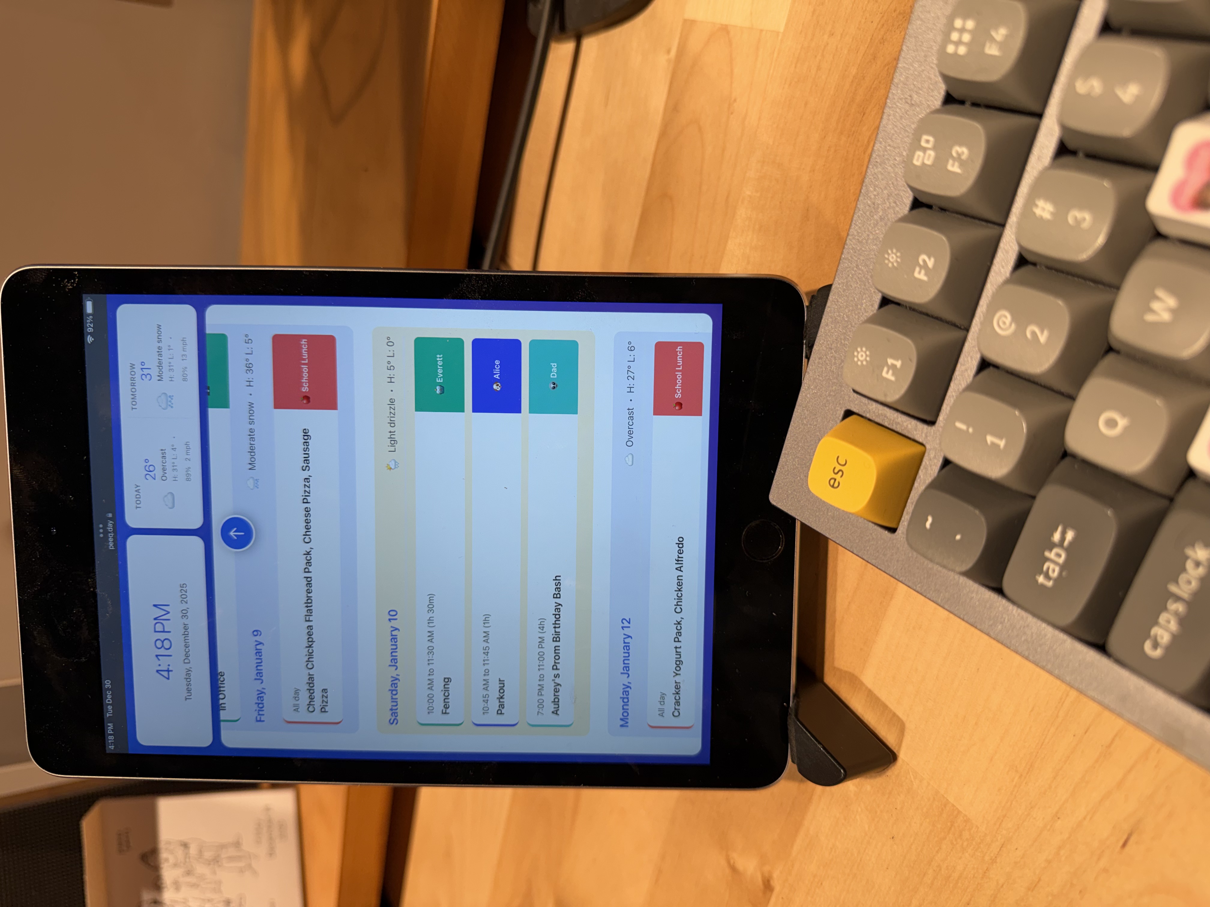 peeq on tablet desk stand showing school lunch menu